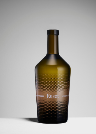 Antique green glass bottle with a high-precision black gradient dot pattern created entirely via organic screen printing